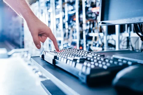 IT specialist pressing red button on keyboard. Big data center. High tech server computers at work SSUCv3H4sIAAAAAAAACnRSPU/DMBDdkfgPkedGNHbSFkaQ2NjYKoaLcyRWHbvyB6iq+t+x4xh5gM333t27e3e+3t9VFenBCk6eqmuMQiyk9NYZcEKrAG83K25QDWhKBAfhtBEgS7AHxycFMwZQeSkjfFtIYh04b9HGZivEweEYNBL4K5EmOqa4ysRChopAkXcMXbTU44VsCtb6PrIvej57h8aSzKV+/4g9eysUWvvwKhQojn9JvgnLUUpQqH0hmx4f2T2MqPhlMVgYNygRkvFjSiWn7zDeXK4C/CB0sYUvzUHGBFYonY3gQo1FmXbTcpVcxrVXzsQRSLZBpNZn6GU8yWfQxIxPYG1IHzJeNOLhD+i56KO0WwysqmQIl4thwyjd71jD2t2OMtp23ZqQrj2JoLOMk4VCzE9iKK2LOAF5xAM2+5bWDYVt3W5pW/ddz+pmP7S8PbDu8EnD4m8/AAAA//8DAFBRYFC3AgAA